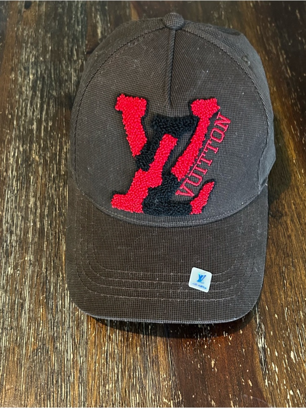 Brown red logo hat
